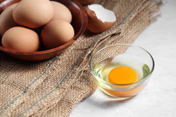 Group of of raw chicken eggs on rustic background, Ingredient for Scrambled eggs in loft style kitchen