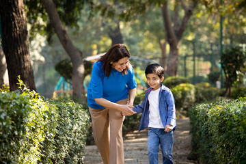 Fototapeta premium Cheerful grandmother spending leisure time with grandson