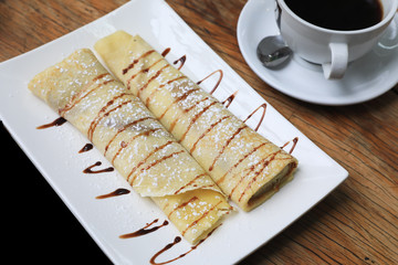 Pancake and coffee served in a restaurant