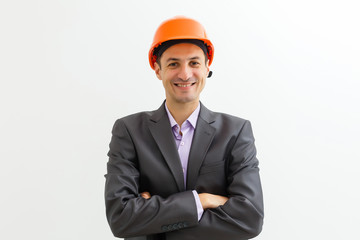 Building worker and architect discussing build drawing on construction site. industrial engineer wearing safety hard hat have meeting commercial building structure