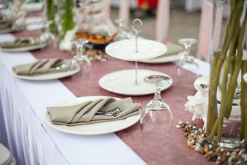 beautiful served table setting with plates on outdoor park
