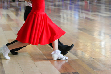 girl and boy dancing ballroom dancing on the floor - obrazy, fototapety, plakaty