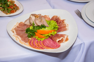 Beautiful sliced different types of smoked meat