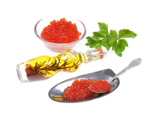 Red  caviar ,green spices, silver spoon,isolated on white background  .Selective focus .