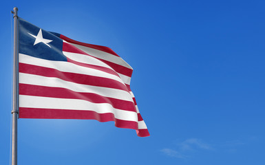 Liberia flag waving in the wind against deep blue sky. National theme, international concept. Copy space for text.