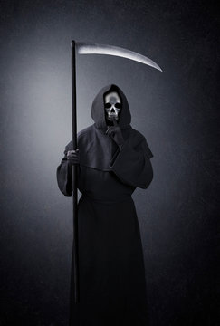 Grim reaper with scythe showing hush sign