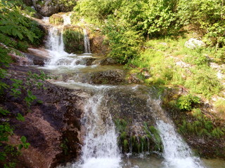 Obraz premium Vrachanska Skaklya Waterfall - the highest in Bulgaria - 141 meters, and around him.
