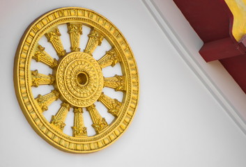 Close up view shot of Thammachack gold art on white background.