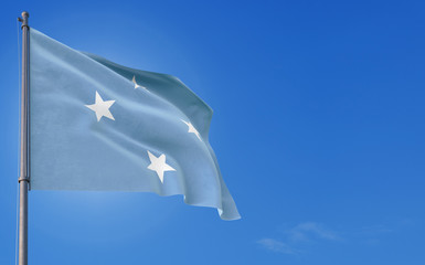 Micronesia flag waving in the wind against deep blue sky. National theme, international concept. Copy space for text.