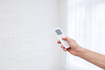 Hand holding a remote control