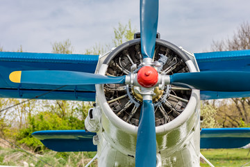 Old airplane. Vintage steel propeller plane polished up at air show