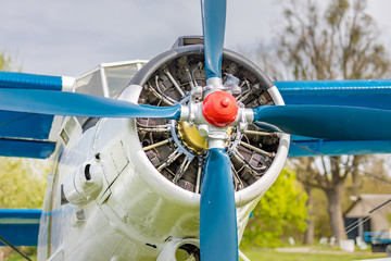 Old airplane. Vintage steel propeller plane polished up at air show