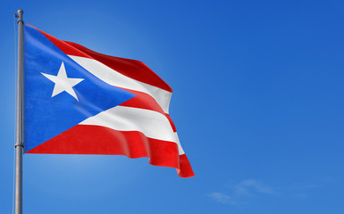 Puerto Rico flag waving in the wind against deep blue sky. National theme, international concept. Copy space for text.