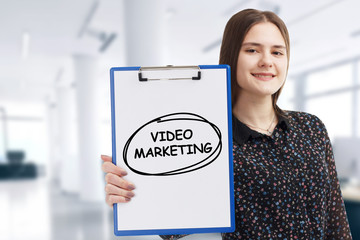 Business, technology, internet and network concept. Young businessman points to a keyword: