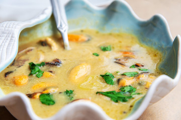 Traditional homemade greek mussels spicy soup cooked with olive oil and mustards