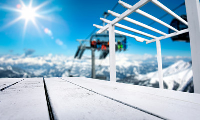 Desk of free space and ski time in mountains. 