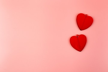 Decorative hearts on pink background. Place for text.