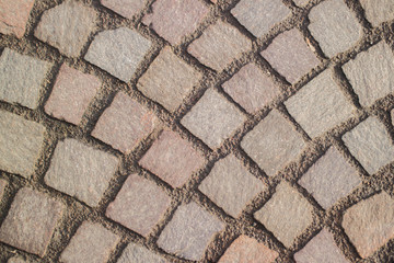 Old stone cubical brick pavement