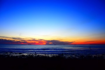 Sunset on the beach whit red sky