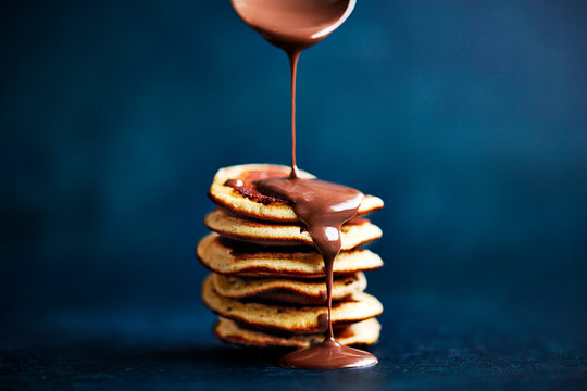 Mini pancake stack with drizzled chocolate spread 