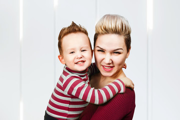 Mother and son who are smiling playing together