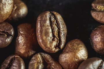 Fototapeta premium coffee grains close-up on a black background.