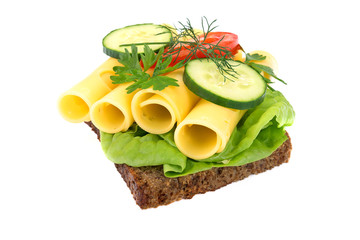 Healthy sandwich with dark full grain rye bread, vegetables and cheese isolated on a white background without shadows
