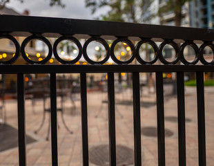 Circles in an iron gate block your path