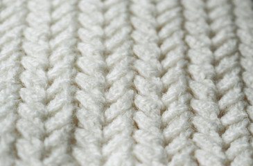Knitting. Patterns. Natural yarn. Cotton. Wool. White and beige background.