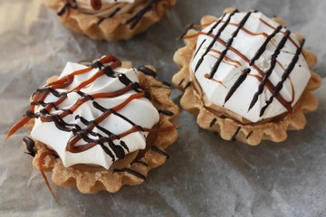 Delicious cakes with caramel and meringue macro