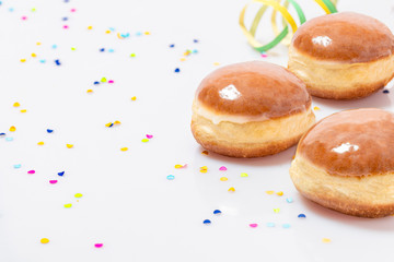 3 pieces of Glazed doughnuts with konfetti and streamers 