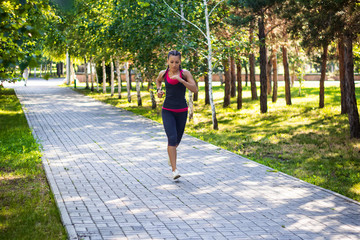 sporty woman doing jogging in the park