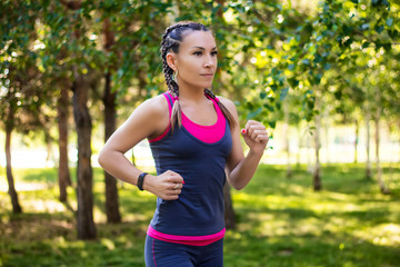 sporty woman doing jogging in the park