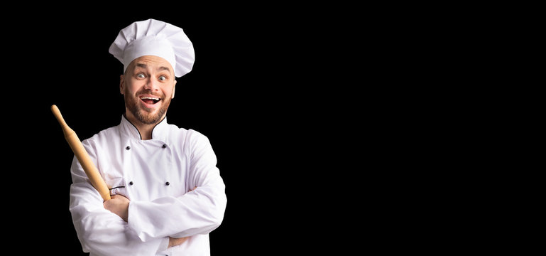 Excited Baker Posing With Dough Rolling Pin Over Black Background