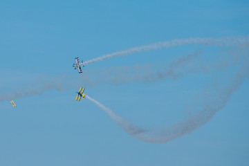 Airplanes on airshow. Aerobatic team performs flight at air show