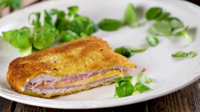 cordon bleu and salad in plate