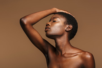 Beauty portrait of young half-naked african woman with short black hair