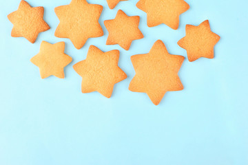 Gingerbread cookie star on blue background