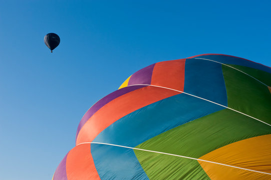Colorful hot air balloons flying in sky during balloon festival