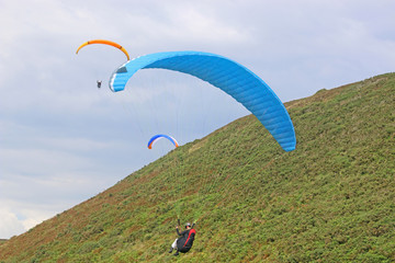 Paragliders flying above Rhossili	