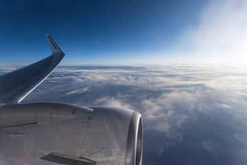 View of plane wing with blue sky
