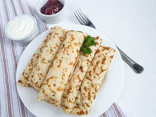 Pancakes with homemade cottage cheese. Sour-milk fermented product. Healthy, delicious breakfasts. With sour cream and raspberry jam.