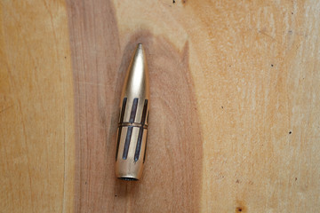Ammo bullet of large caliber machinegun. Image for catalogue content.
