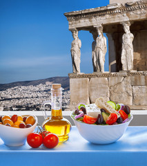 Famous Acropolis with Greek salad in Athens, Greece
