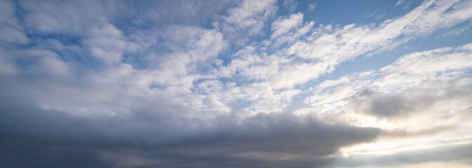 Naklejka na ściany i meble Evening sky background with clouds
