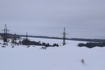 winter rural landscape with frozen river and bridge