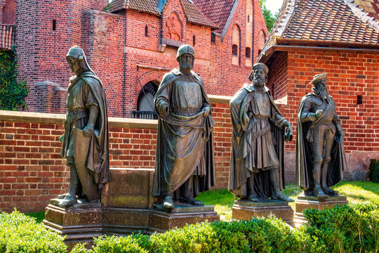 Statues of the major Teutonic Order great masters at the Middle Castle fortress inner courtyard of the Medieval Teutonic Castle in Malbork, Poland