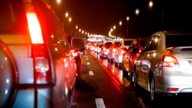  Blurred traffic jam on express way and car brake light in bangkok, thailand on night and copy space