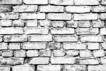 Texture of a brick wall with cracks and scratches which can be used as a background