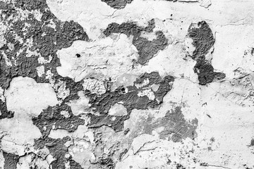 Texture of a concrete wall with cracks and scratches which can be used as a background
